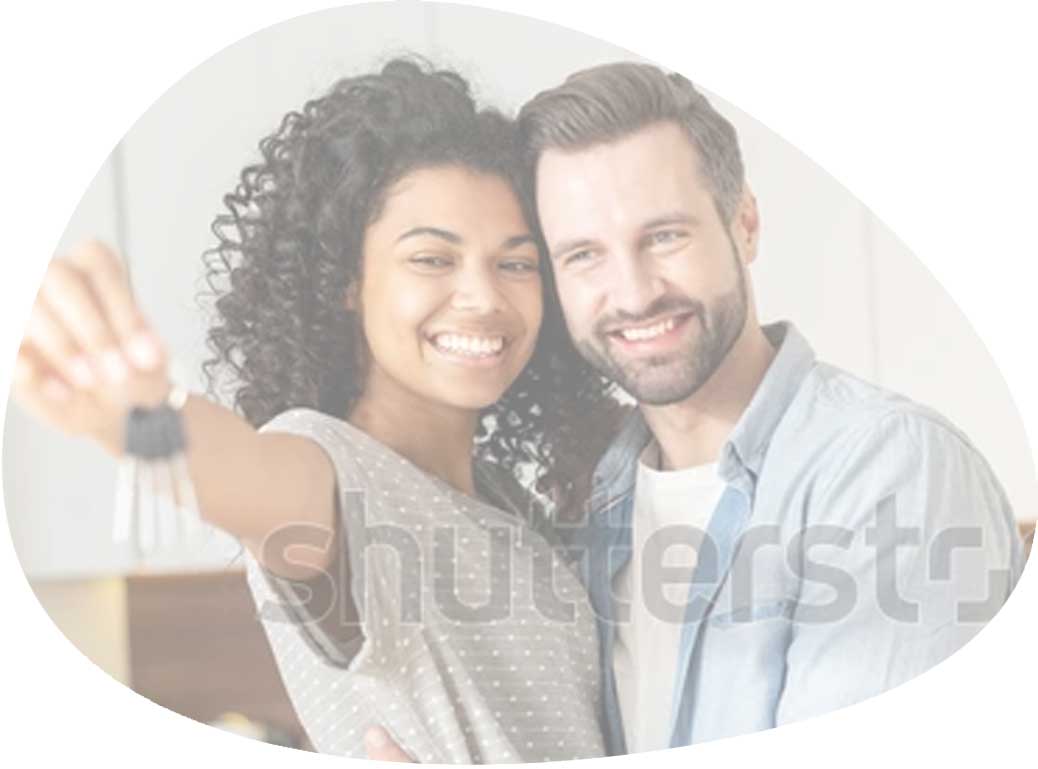 Couple smiling while holding house keys